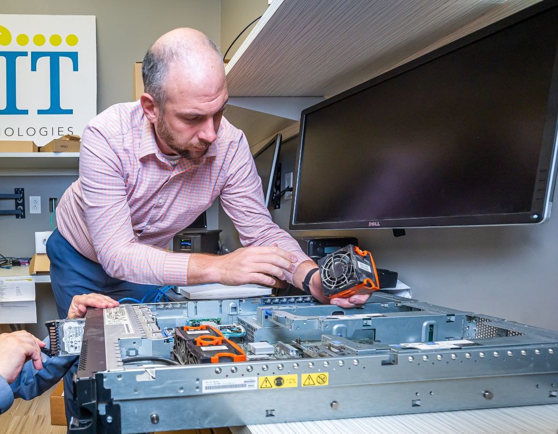 team members working on devices